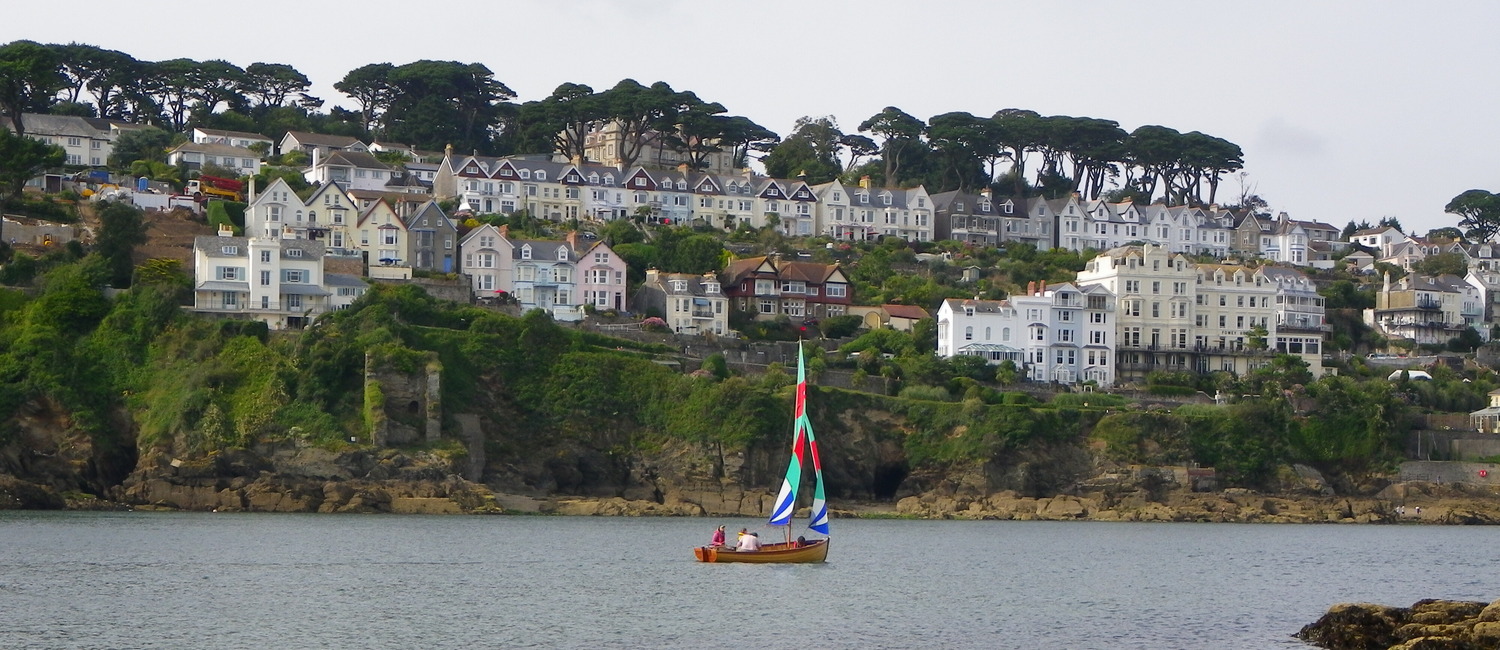 Boat sailing past The Fowey Hotel